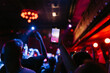 © Mal de Ojo Studio/Stocksy - Concert Crowd Capturing Live Performance