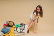 © Eloisa Ramos/Stocksy - kid with recycling clothes bag
