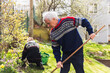 © Diego Martin/Stocksy - Senior couple cutting weeds and cleaning up at garden