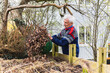 © Diego Martin/Stocksy - Senior man cleaning up on his garden