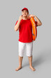 © Pixel-Shot - Male lifeguard with ring buoy and whistle on grey background