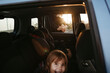 © Irina Polonina/Stocksy - Sunset Drive With Smiling Child and Passenger