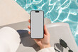 © Artem Podrez/Stocksy - Mockup phone with white screen. Summer Vibes by Pool