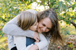 © Serena Burroughs/Stocksy - laughing mother and daughter outdoors together