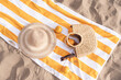 © Mal de Ojo Studio/Stocksy - Sunlit Beach Picnic Setup with Accessories