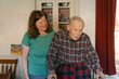 © Lea Jones/Stocksy - senior citizen with his daughter and caretaker  in his home