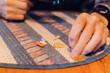 © Lea Jones/Stocksy - close up of senior citizen hands taking medication and vitamins