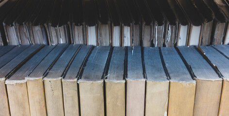 Close up of old books on shelf