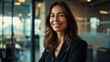 © ปฏิภาน ผดุงรัตน์ - Happy confident business woman leader looking away standing in office. Smiling professional businesswoman manager executive, female worker feeling cheerful thinking of financial success.