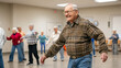 © Michael - Elderly man with a radiant smile enjoys dancing in a community hall filled with dancing couples