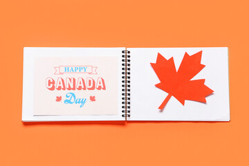 Wall Mural - Maple leaf and greeting card on red background. Canada Day concept