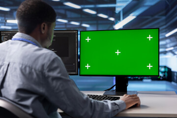 Poster - african american man in data center using green screen computer to check for server performance issu
