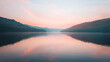 © Alon - Tranquil lake at sunrise, mirror-like water reflecting the pastel sky, surrounded by forested hills, serene and peaceful, Photography, taken with a 24