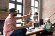 © Wavebreak Media - Diverse colleagues in office using vr headset