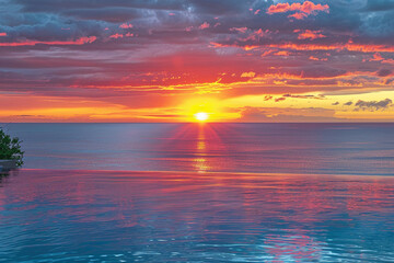 Wall Mural - A vibrant sunset over a calm ocean, reflecting a serene and peaceful state of mind.