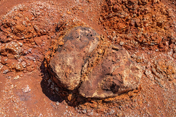 Wall Mural - Spheroidal weathering basalt， Waimea Canyon Basalt / Napali Member / Lava flows, Kauai, Hawaii. Red soil. 