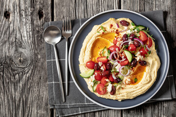 Wall Mural - Greek hummus with veggies, olives, feta on plate