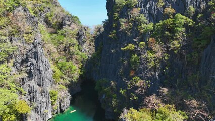 Wall Mural - Beautiful Aerial view of One of the best island and beach destination in the world, a stunning view of rocks formation and clear water of El Nido Palawan, Philippines.	