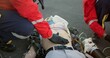 © CineLens/peopleimages.com - Healthcare, outdoor and paramedic with patient, helping and hand on stomach, check and oxygen mask. Street, teamwork and rescue of person, EMS and palpate of abdomen, accident and first responder