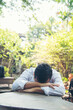 © aFotostock - Failure businessman stress bankruptcy man sitting wood desk feeling nagative depression have headache. Men unemployed jobless recession crisis stress lost job. Despair Failure businesspeople concept