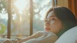 © Denisa - Asian young woman waking up in the morning