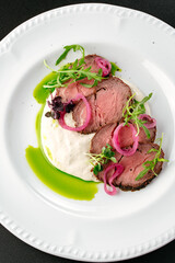 Canvas Print - grilled beef tenderloin with sauce on a plate