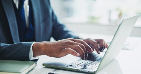 Businessman, hands and typing with laptop for accounting, email or finance on desk at office. Closeup of employee man, accountant or investor working on computer for financial budget, report or tasks