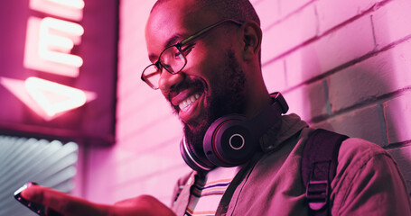 Poster - Cellphone, texting and black man with smile, headphones and communication with contact and online. Student, social media and chat on app, typing and happy in campus, college and Gen z with connection