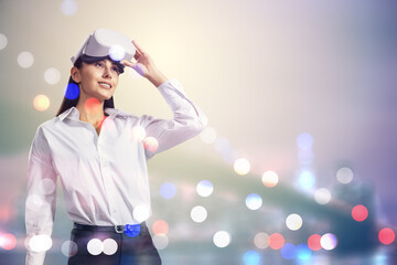 Poster - Attractive young european businesswoman with VR glasses standing on blurry bokeh city background with mock up place. Metaverse and virtual reality concept. Double exposure.