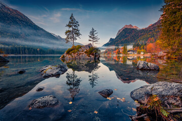 Wall Mural - dramatic autumn scene of hintersee lake. misty morning view of bavarian alps on the austrian border,