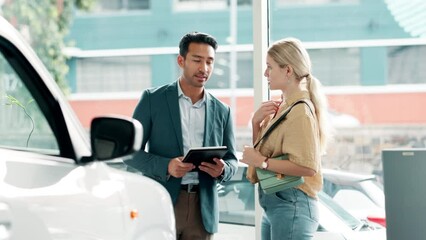 Canvas Print - Woman, man and tablet in car dealership for advice, negotiation or consulting in vehicle finance. Discussion, salesman and customer shopping in transport showroom with digital app for auto insurance