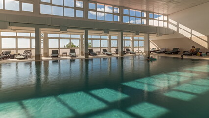 Panorama showing luxury indoor swimming pool, part of hotel timelapse