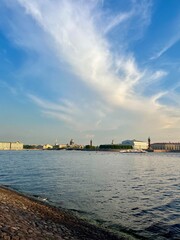 Wall Mural - city river view, river in the city center, blue sky, white clouds, summer