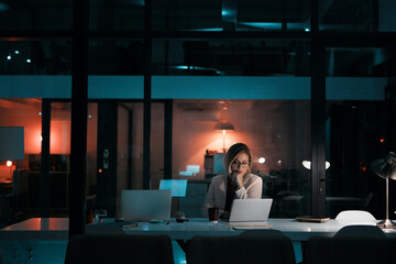 Wall Mural - Night, glass and woman thinking with laptop in office for planning, research and brainstorming solution. Working late, reading or website designer with pc for online, communication or problem solving