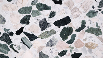 Poster - A mosaic tile floor with a variety of colored stones. The tiles are arranged in a way that creates a visually interesting pattern. The colors and textures of the stones create a sense of depth