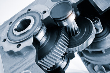 Poster - A close up of a gear with a black and white filter. Concept of precision and complexity, as gears are intricate and interlocking components of machinery. The black and white filter adds a timeless