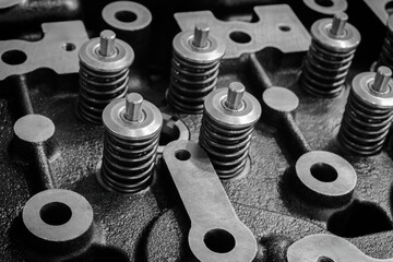 Aufkleber - Close up of valves with many springs on the head of an engine or diesel engine, car repair service concept background, black and white