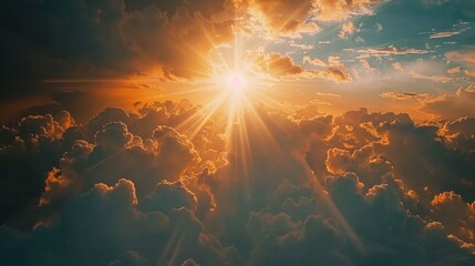 Wall Mural - The sun breaking through the clouds in a beautiful sky