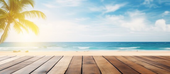 Aufkleber - Tropical fine sandy beach with blured sea sun sky clouds background with wooden table top and empty space for product advertisement Montage of summer relaxation background. Creative banner