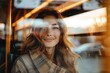 © Pinklife - A young lady sits inside a bus, her face intentionally unrecognizable, with a warm reflection from outside the window
