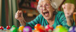 © Ai Studio - An elated elderly woman with bright glasses celebrates triumphantly while playing a colorful board game, radiating joy and excitement in her cozy home.