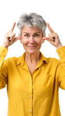 Canvas Print - Joyful mature woman in a yellow shirt, pointing at her temples with both index fingers
