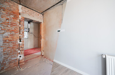 Wall Mural - Photo collage of apartment room before and after restoration or refurbishment. Old room with doorway and new renovated living room with parquet floor and elegant interior design.