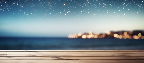 Poster - Top of wood table with seascape and palm tree blur bokeh light of calm sea and sky at tropical beach background Empty ready for your product display montage summer vacation background concept