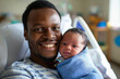 © zakiroff - Father holding newborn baby in hospital, joyous family moment concept