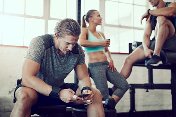Aufkleber - Man, fitness and typing with phone at gym for workout schedule, routine or browsing tips. Active male person scrolling on mobile smartphone for online tutorial, sports or exercise at health club