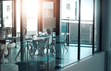 Poster - Table, empty and chair for modern conference room, corporate and meeting boardroom in building. Vacant, furniture and seats for luxury office or workplace, interior and minimalist design with glass