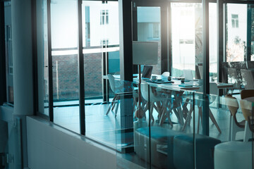 Poster - Empty room, table and chair for modern conference, corporate and meeting boardroom in building. Vacant, furniture and seats for luxury office or workplace, interior and minimalist design with glass
