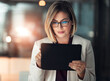 © peopleimages.com - Corporate woman, tablet and working at night in office for company agenda, research and planning. Executive, technology and reading email or report for business results, growth and revenue with data