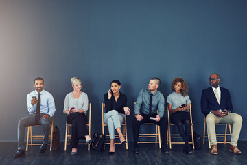 Business people, recruitment and waiting in line with technology for hiring process and employment opportunity. Diverse group, job seeker and phone in row for HR meeting with mockup space and banner